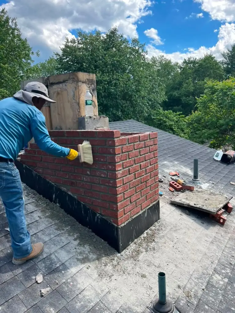 Brick masonry chimney base and hearth